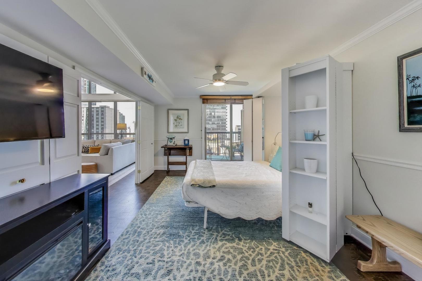 201 East Chestnut Street, Unit 24C Chicago, IL 60611 - Photo 13 of 33 a large room with a couch and a window