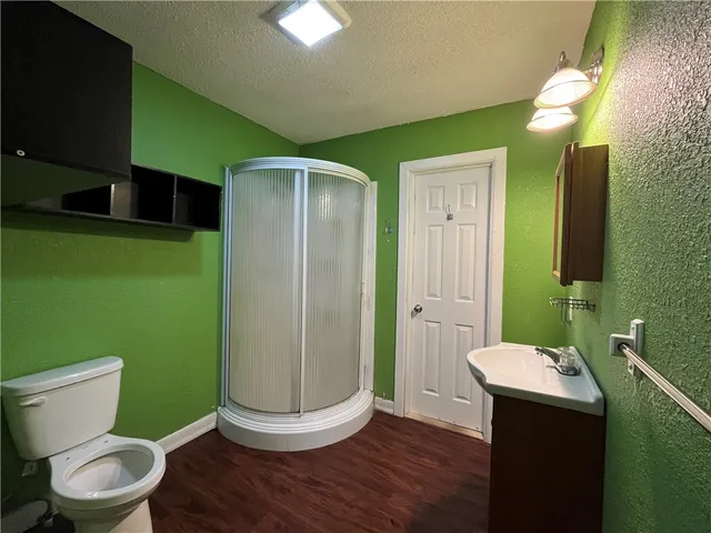 a bathroom with a toilet and a sink