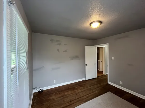 a view of hallway with wooden floor