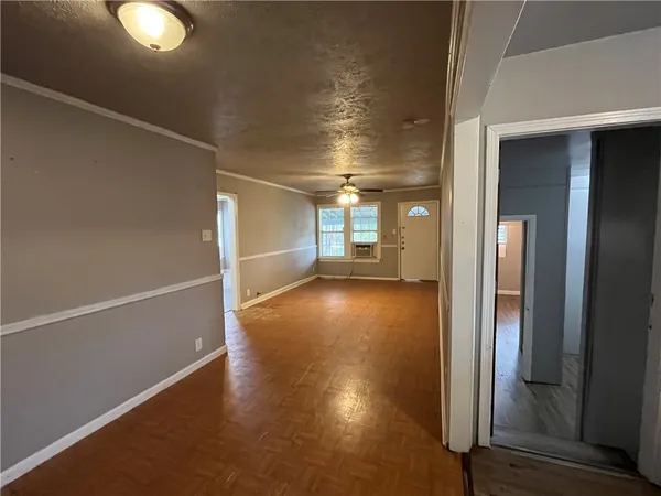 a view of gallery with wooden floor