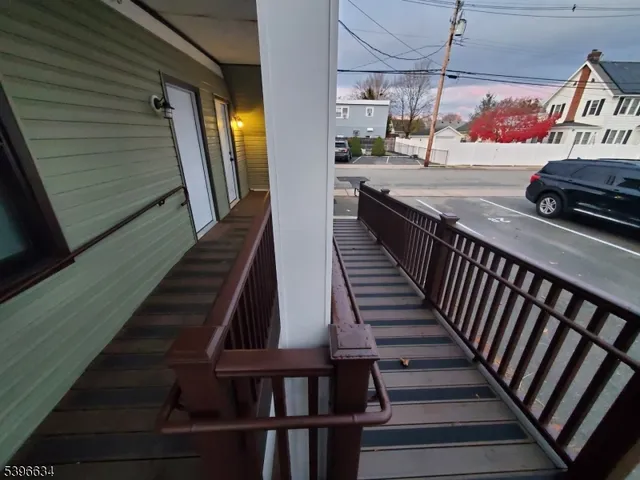 a view of a car parked in front of a house