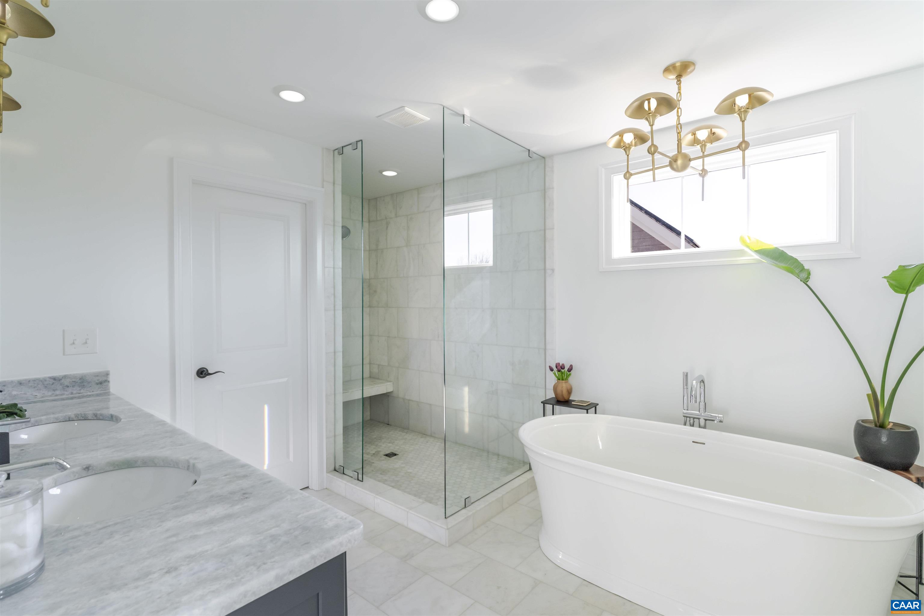 312 Bishopgate Lane Crozet, VA 22932 - Photo 13 of 22 a white bath tub sitting next to a bathroom