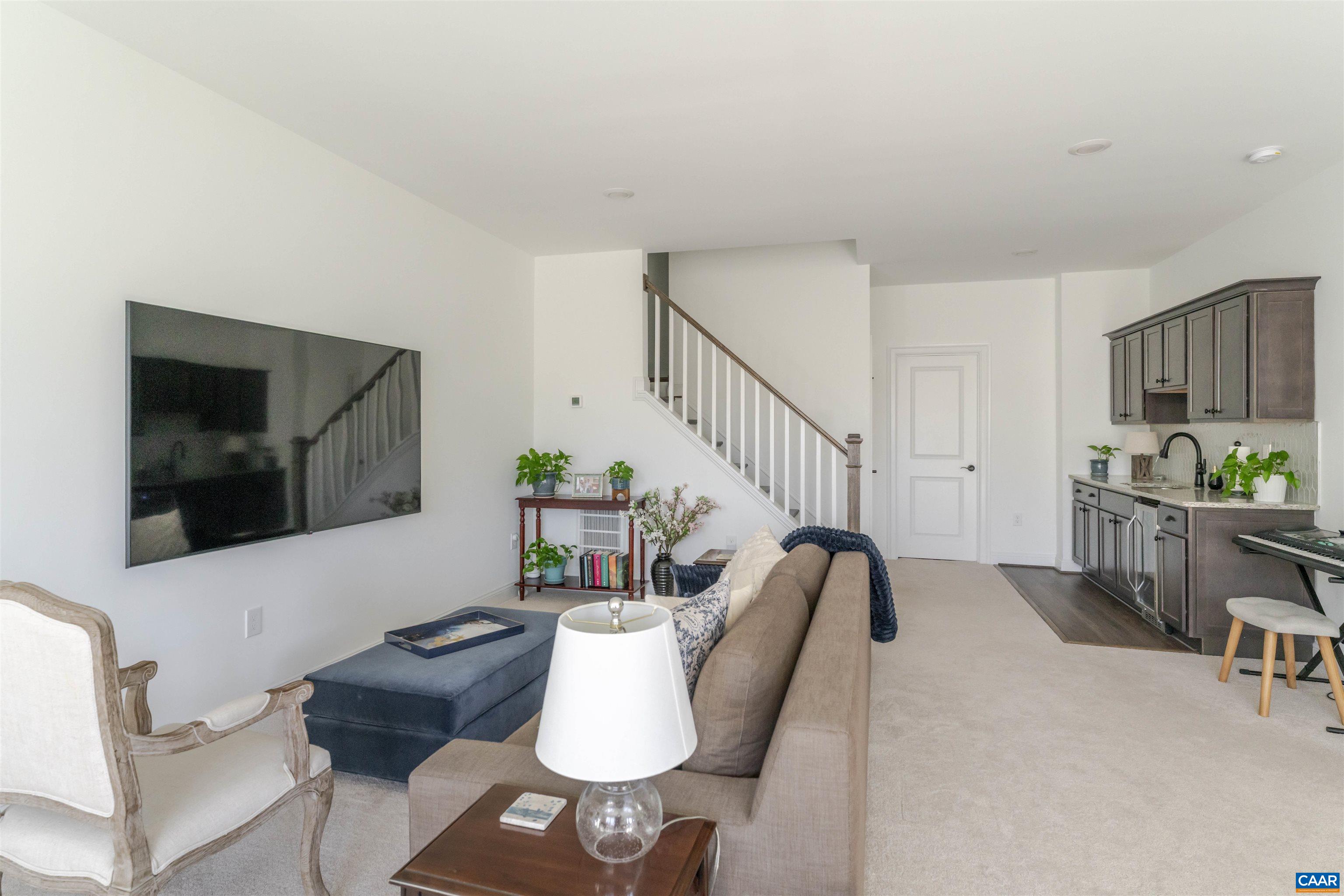 312 Bishopgate Lane Crozet, VA 22932 - Photo 19 of 22 a living room with furniture and a flat screen tv