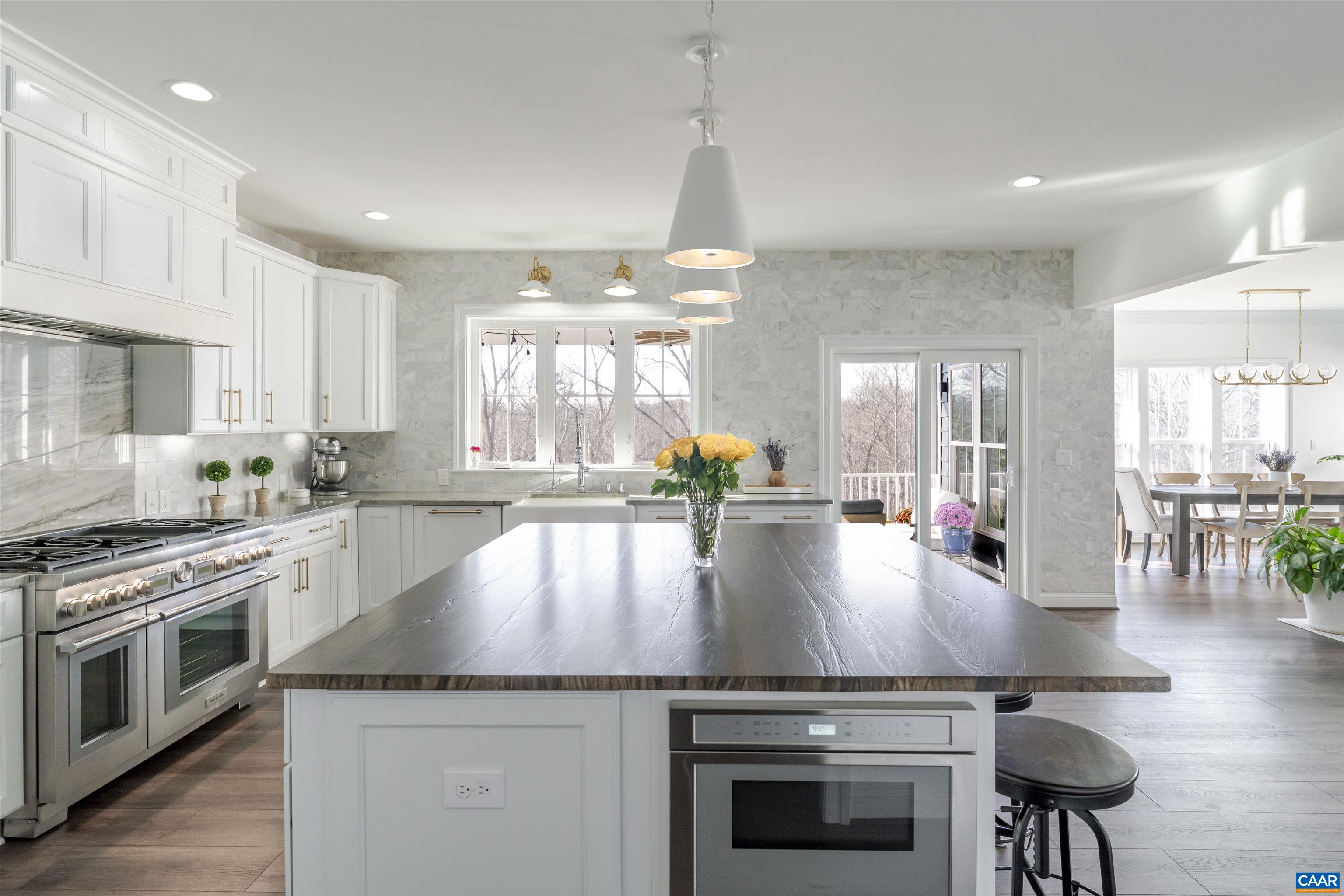 312 Bishopgate Lane Crozet, VA 22932 - Photo 6 of 22 a kitchen with a stove a sink and a refrigerator