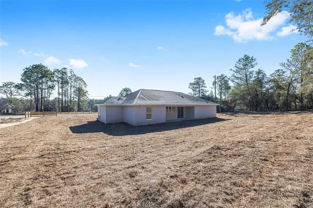 a house with trees in the background