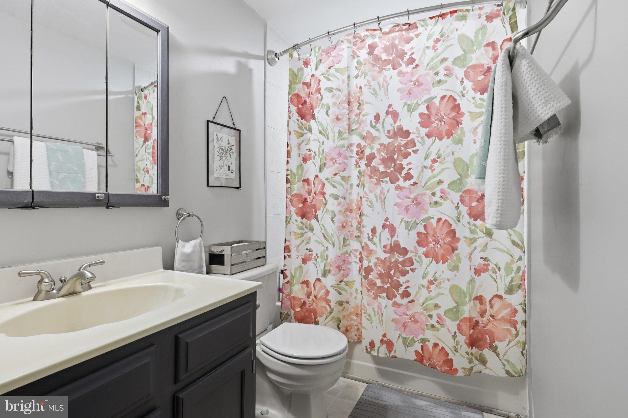 7490 Wounded Knee Road Lorton, VA 22079 - Photo 19 of 34 Full bath upstairs. Shower has new tile