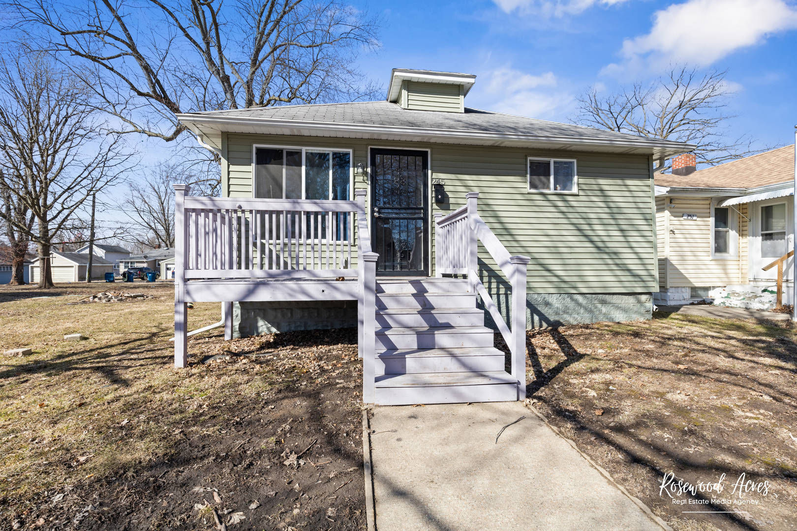 245 North 6th Avenue Kankakee, IL 60901 - Photo 1 of 16 a view of a house with a yard chairs and wooden fence