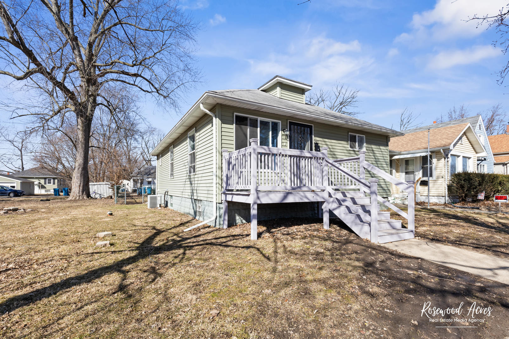 245 North 6th Avenue Kankakee, IL 60901 - Photo 2 of 16 a view of a house with a yard covered in snow