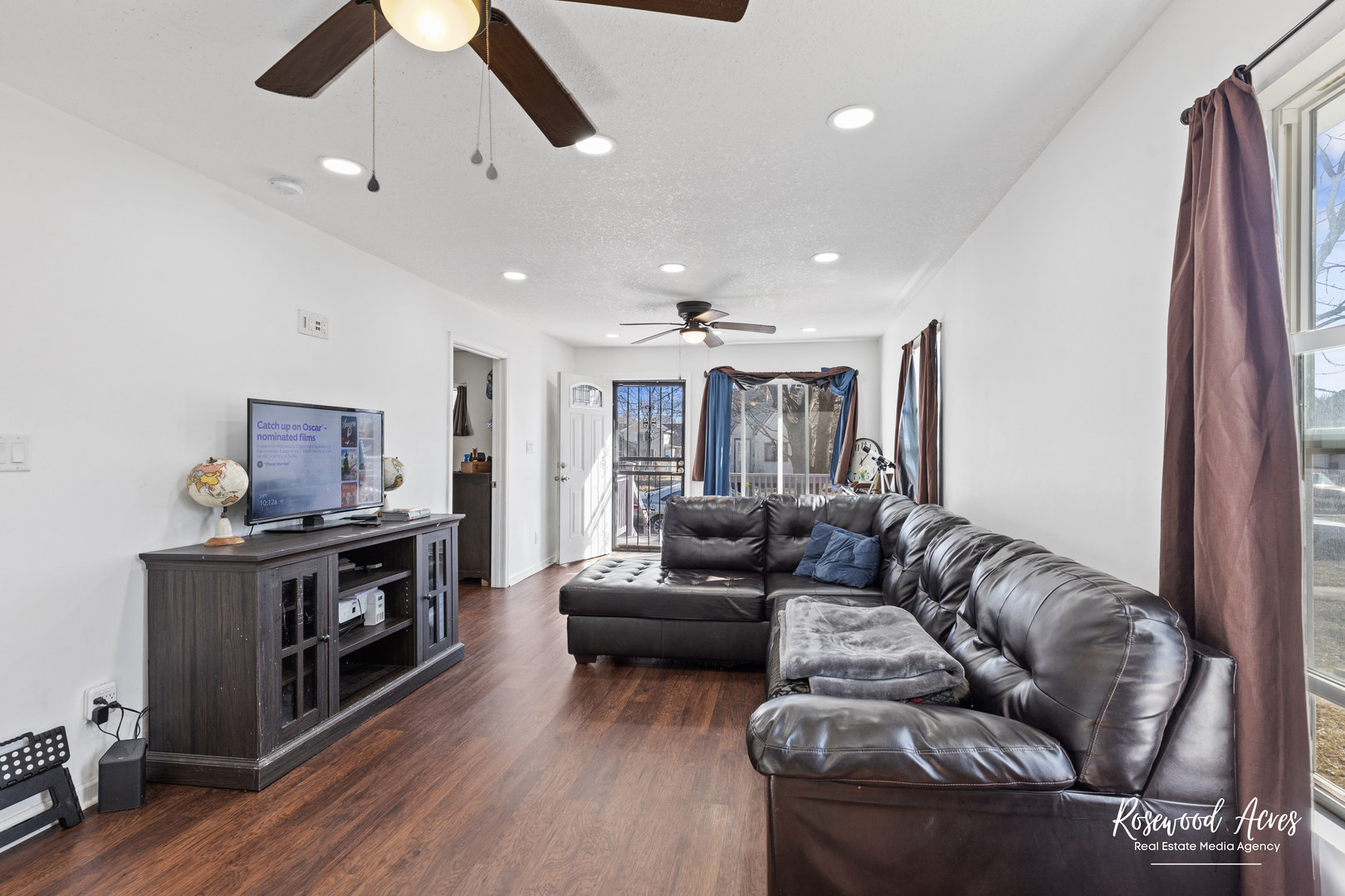 245 North 6th Avenue Kankakee, IL 60901 - Photo 5 of 16 a living room with furniture and a flat screen tv