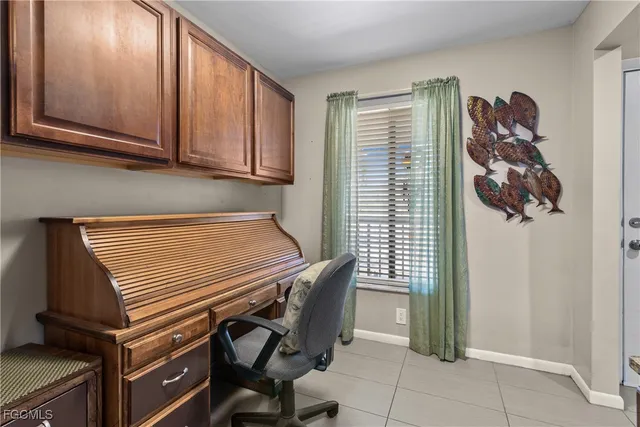 a view of a livingroom with furniture and a window
