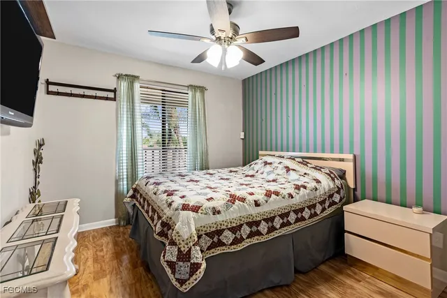 a bed sitting in a bedroom next to a window