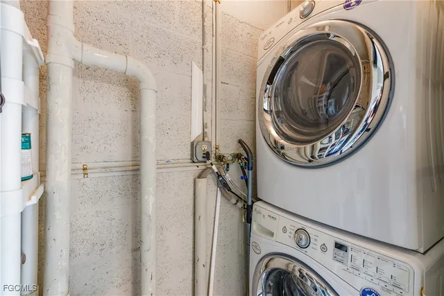 a view of a storage & utility room with dryer and washer