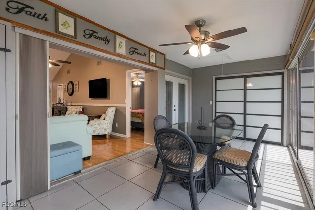 a view of a livingroom with furniture and a flat screen tv