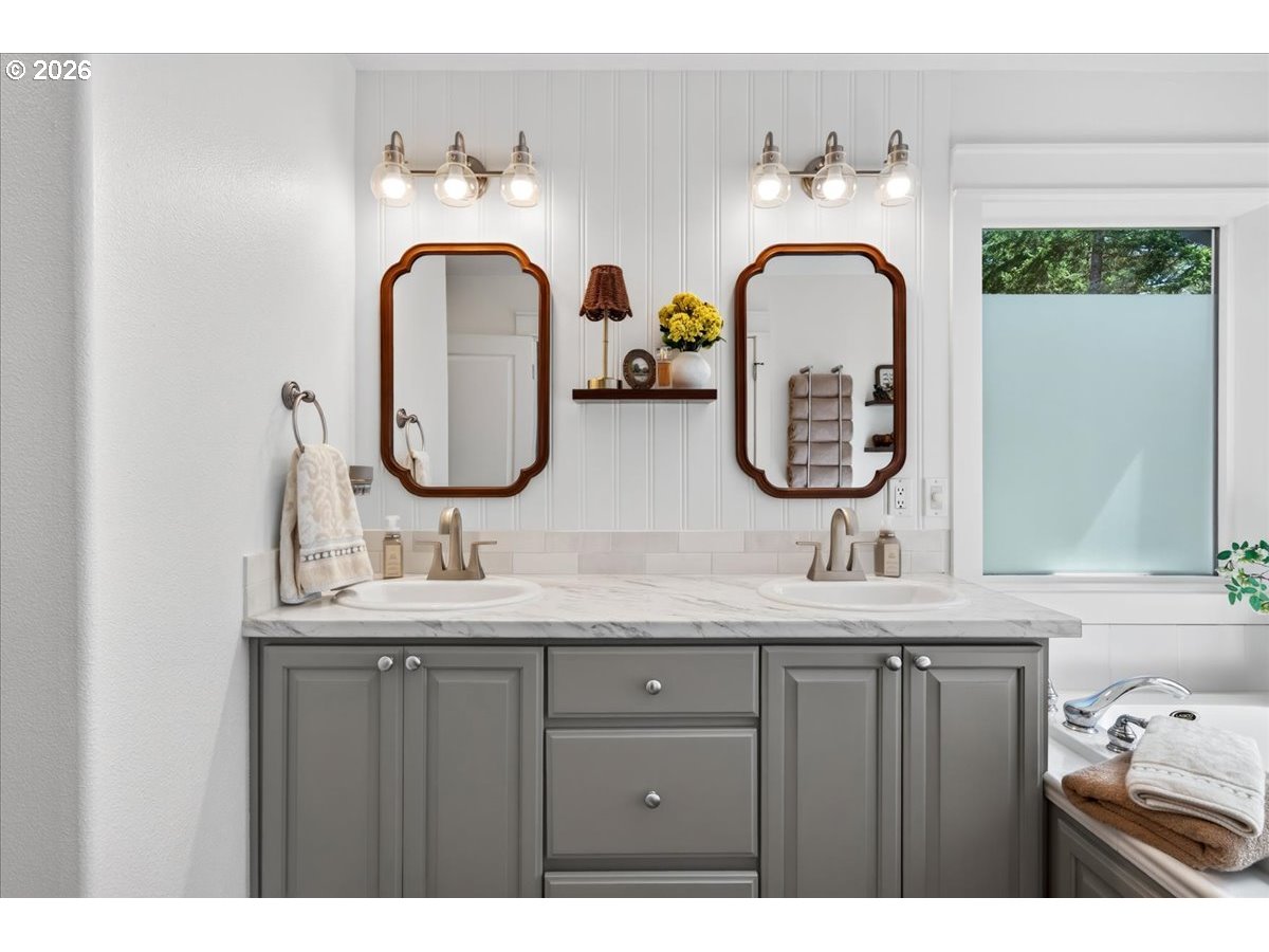 28311 Northwest Nowakowski Road Buxton, OR 97109 - Photo 25 of 48 a bathroom with a granite countertop sink a mirror and window
