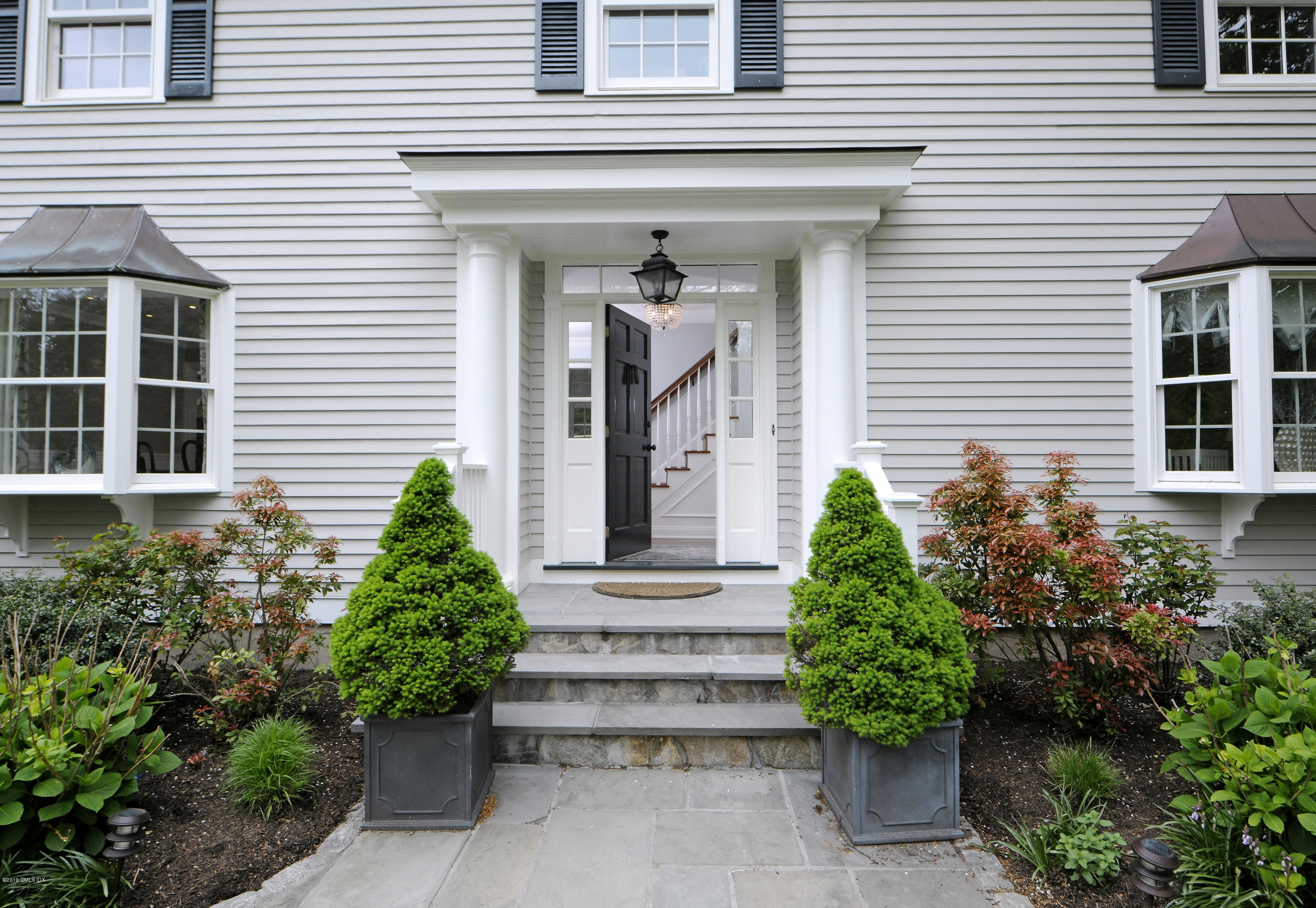 4 Weston Hill Road Riverside, CT 06878 - Photo 4 of 22 a front view of a house
