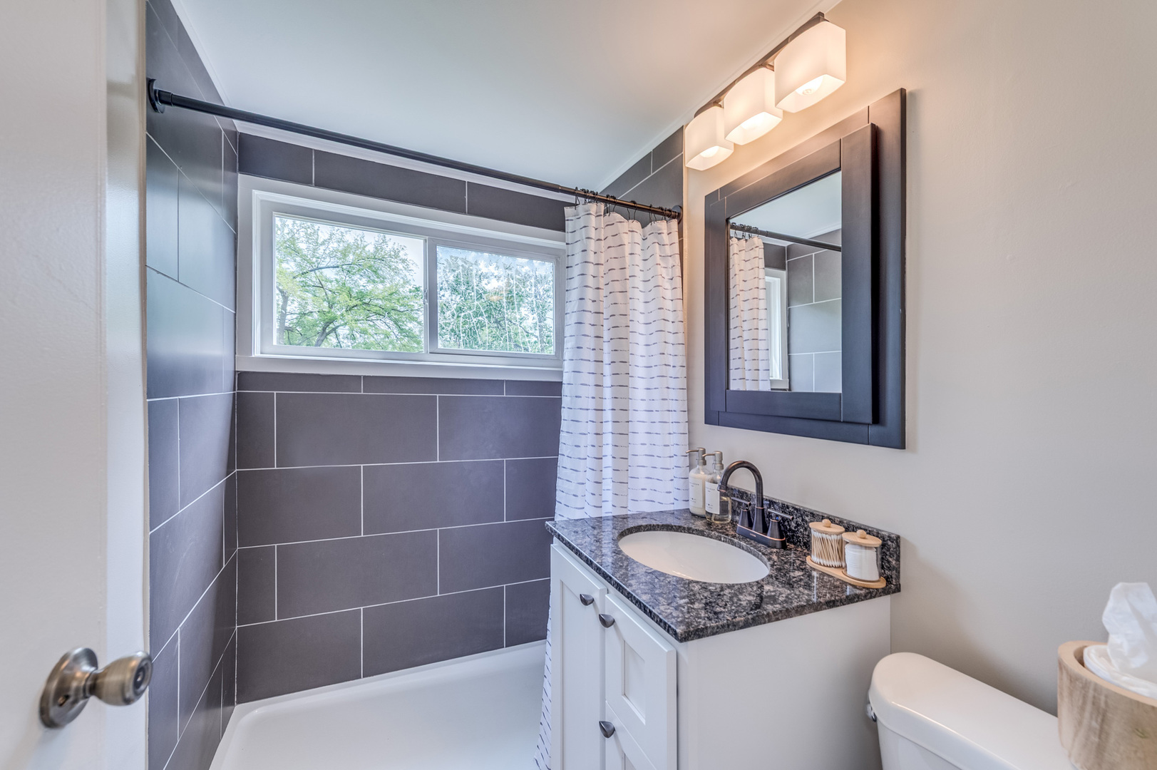 407 Watseka Street Park Forest, IL 60466 - Photo 17 of 21 a bathroom with a granite countertop sink and a toilet