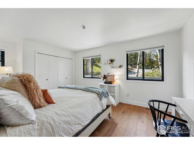 a bedroom with a bed and a table