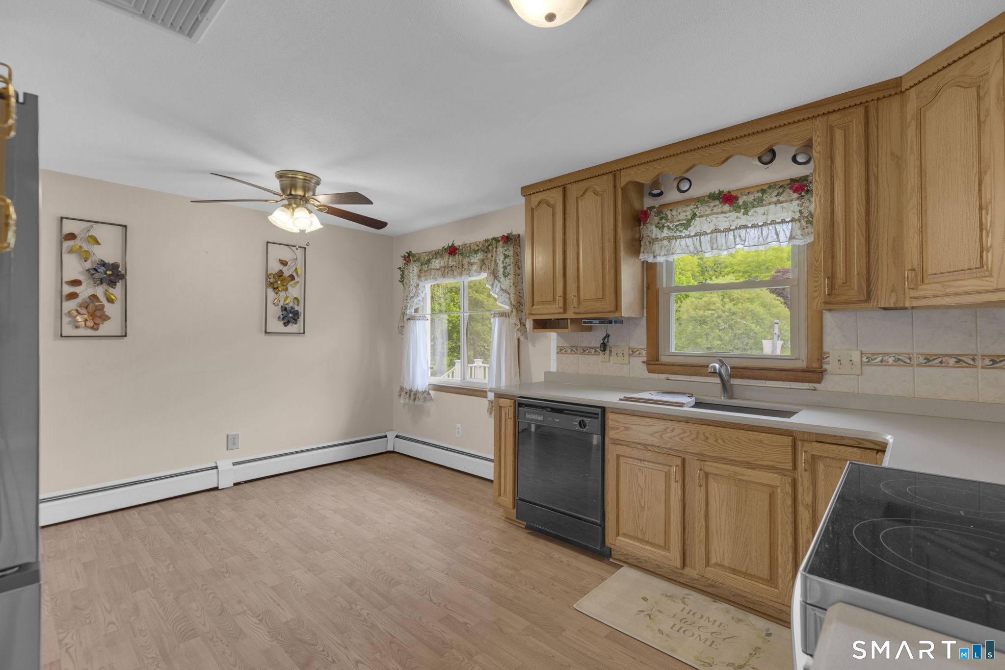 102 Wayne Lane Meriden, CT 06450 - Photo 10 of 36 a kitchen with a sink cabinets and window