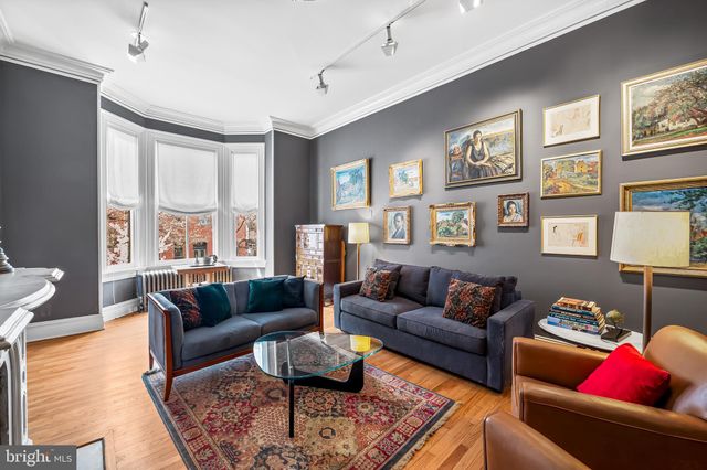 a kitchen with stainless steel appliances granite countertop a sink a refrigerator and a stove