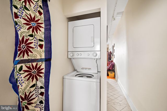 a bedroom with furniture and a wooden floor