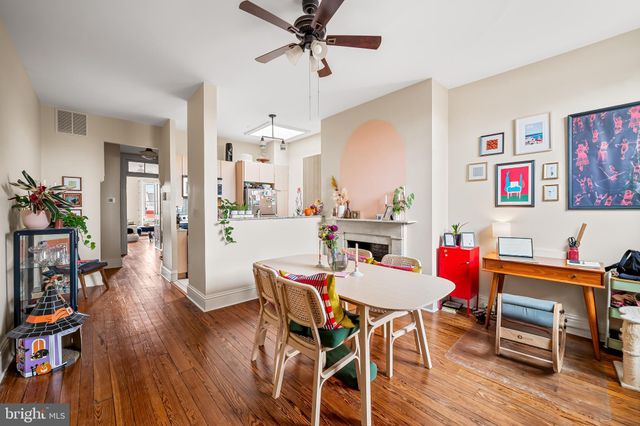 a view of a wooden door with a bench