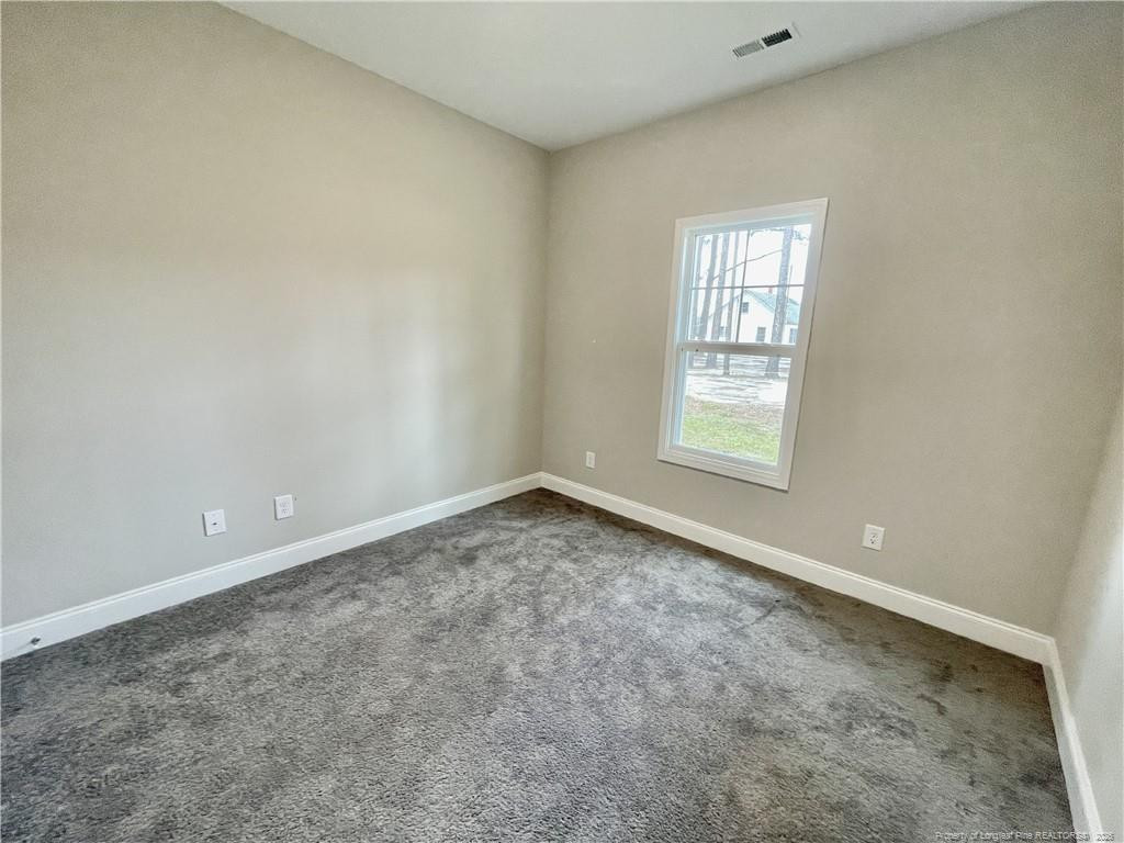 5177 Maxwell Road Stedman, NC 28391 - Photo 15 of 24 an empty room with windows