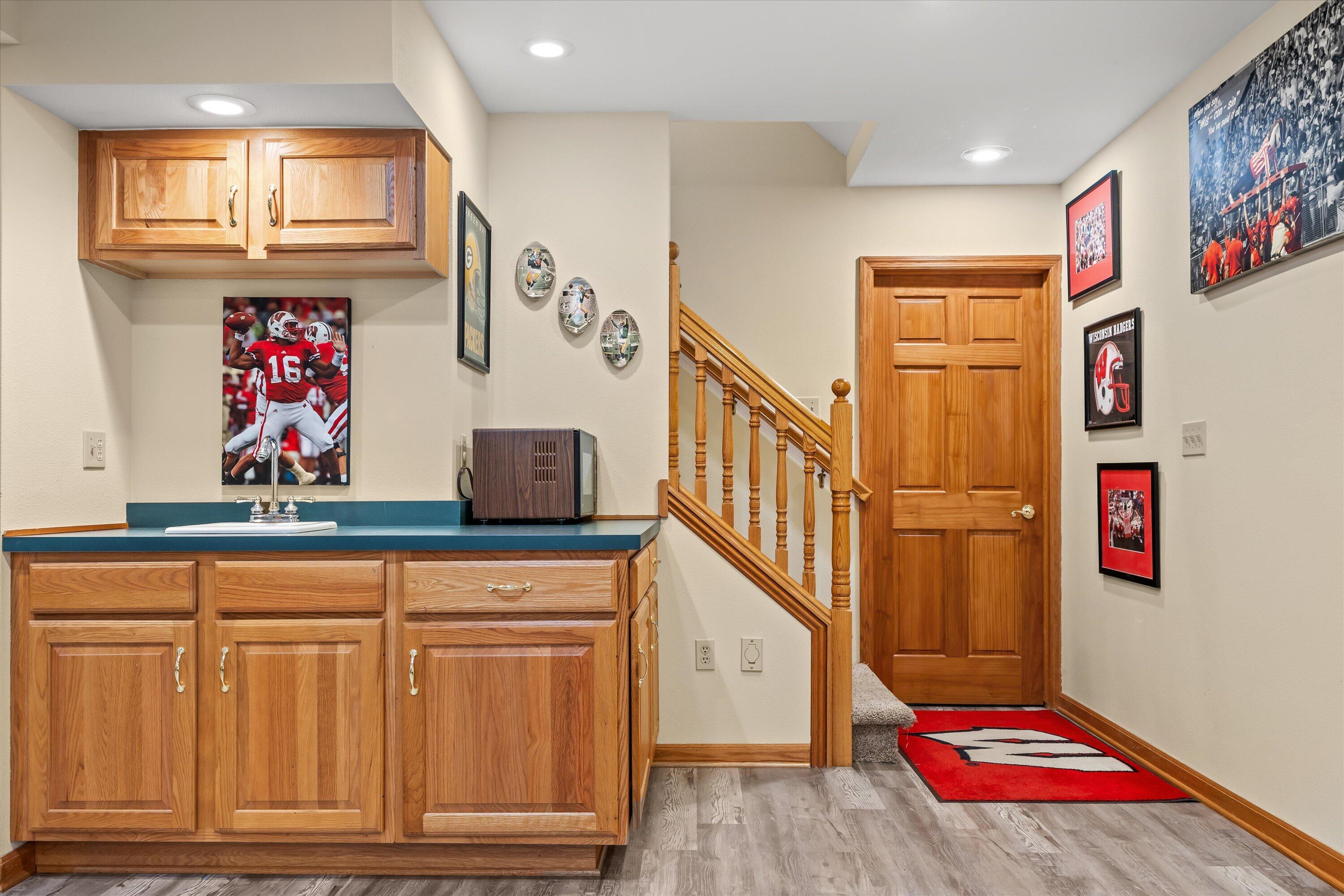 W168N5140 Stonefield Road Menomonee Falls, WI 53051 - Photo 35 of 49 Stairs with door to workroom