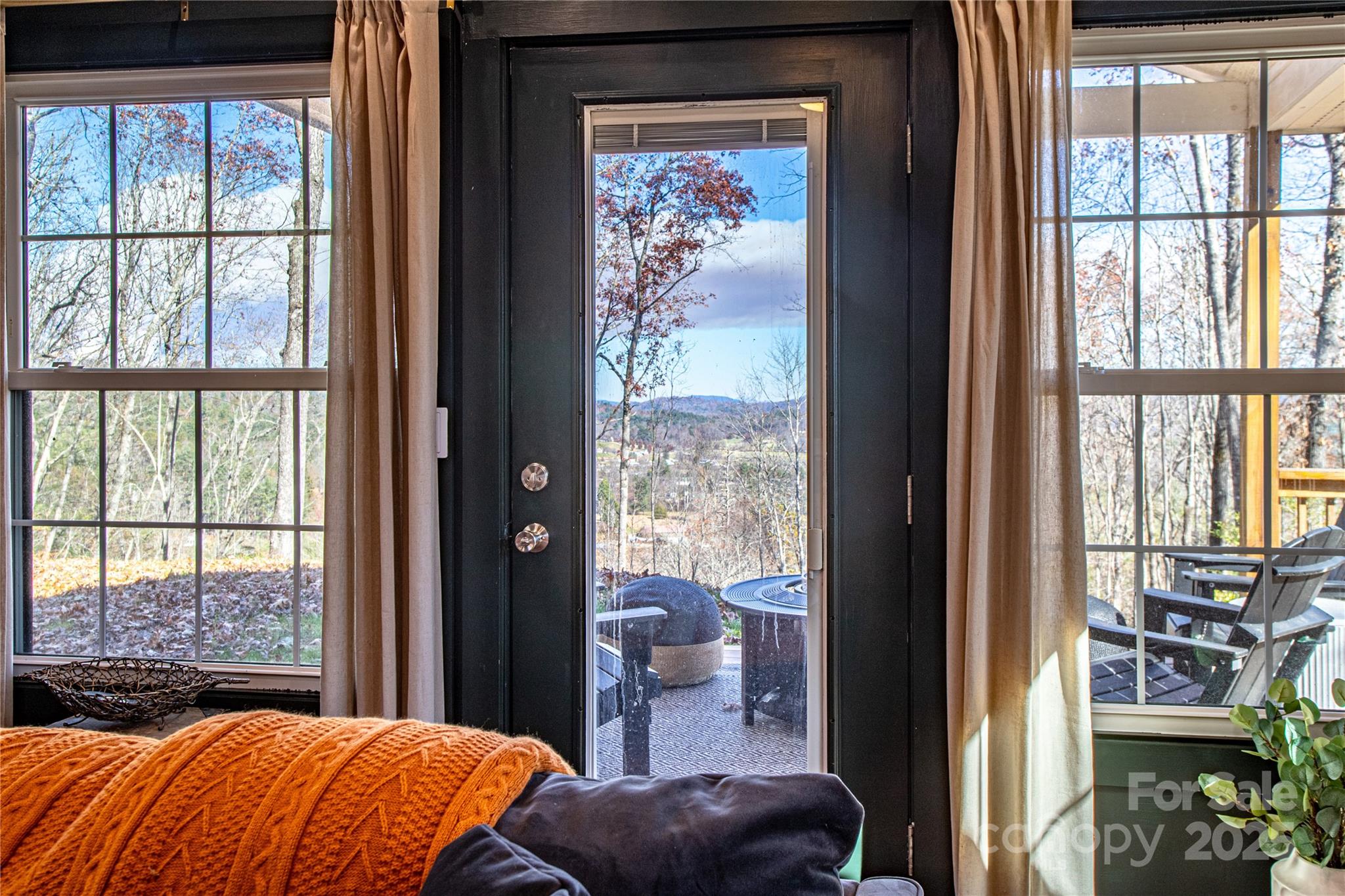 426-428 Weaver Creek Road Brevard, NC 28712 - Photo 17 of 48 a bedroom with a large window and a bed