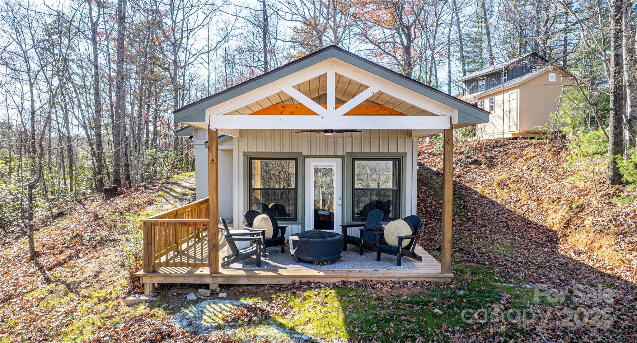 426-428 Weaver Creek Road Brevard, NC 28712 - Photo 2 of 48 a view of house with yard outdoor seating and covered with trees