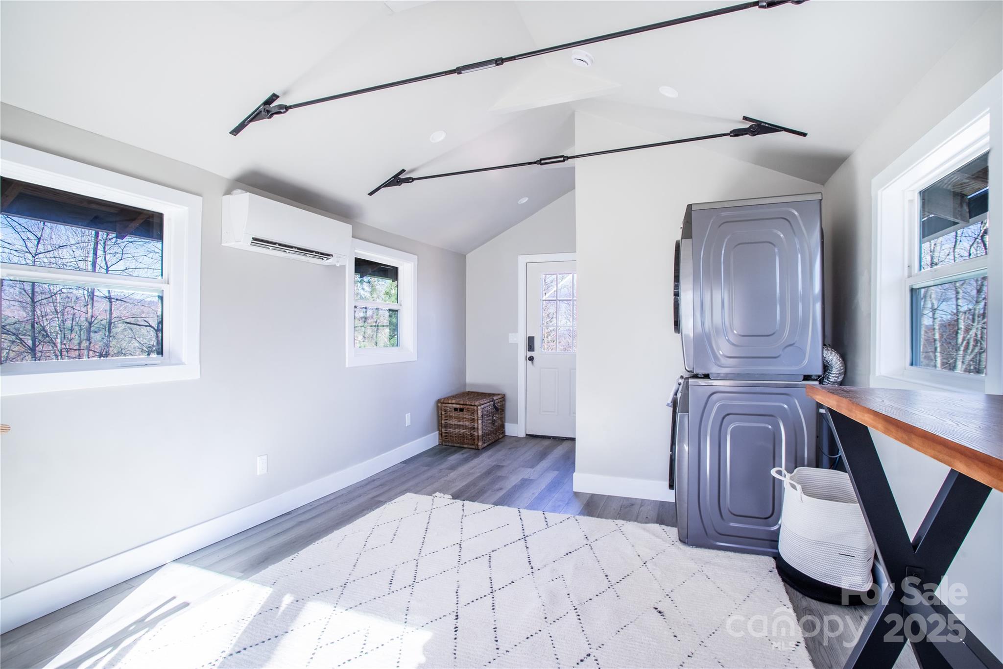 426-428 Weaver Creek Road Brevard, NC 28712 - Photo 42 of 48 a spacious bedroom with a bed and wooden floor