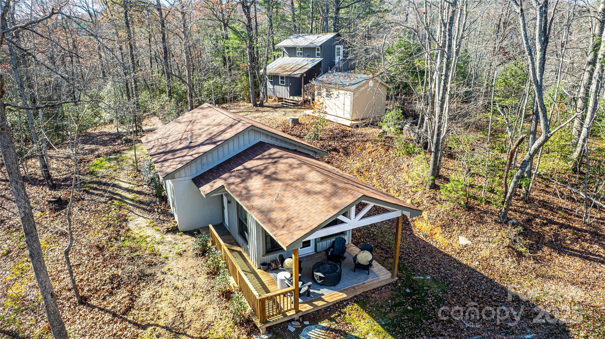 426-428 Weaver Creek Road Brevard, NC 28712 - Photo 5 of 48 a view of a yard with chairs