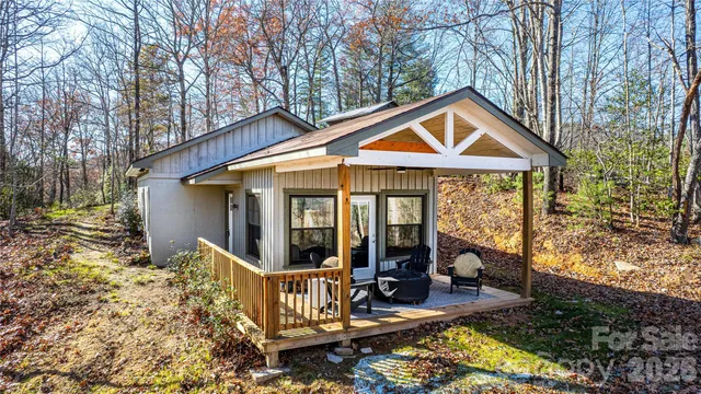 a view of a house with backyard porch and sitting area