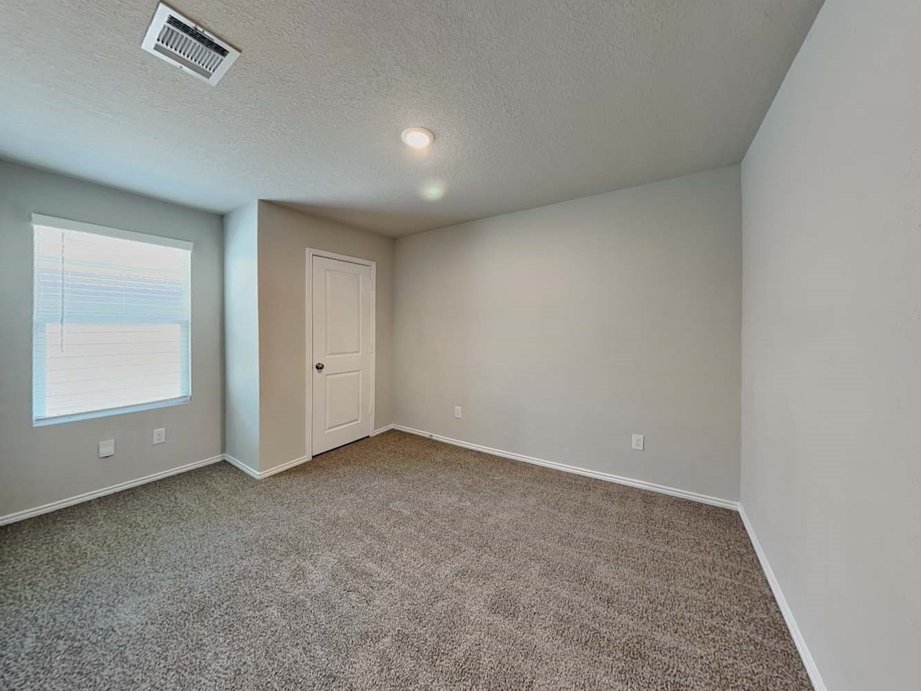 4322 Rapids Way San Antonio, TX 78223 - Photo 12 of 17 an empty room with windows