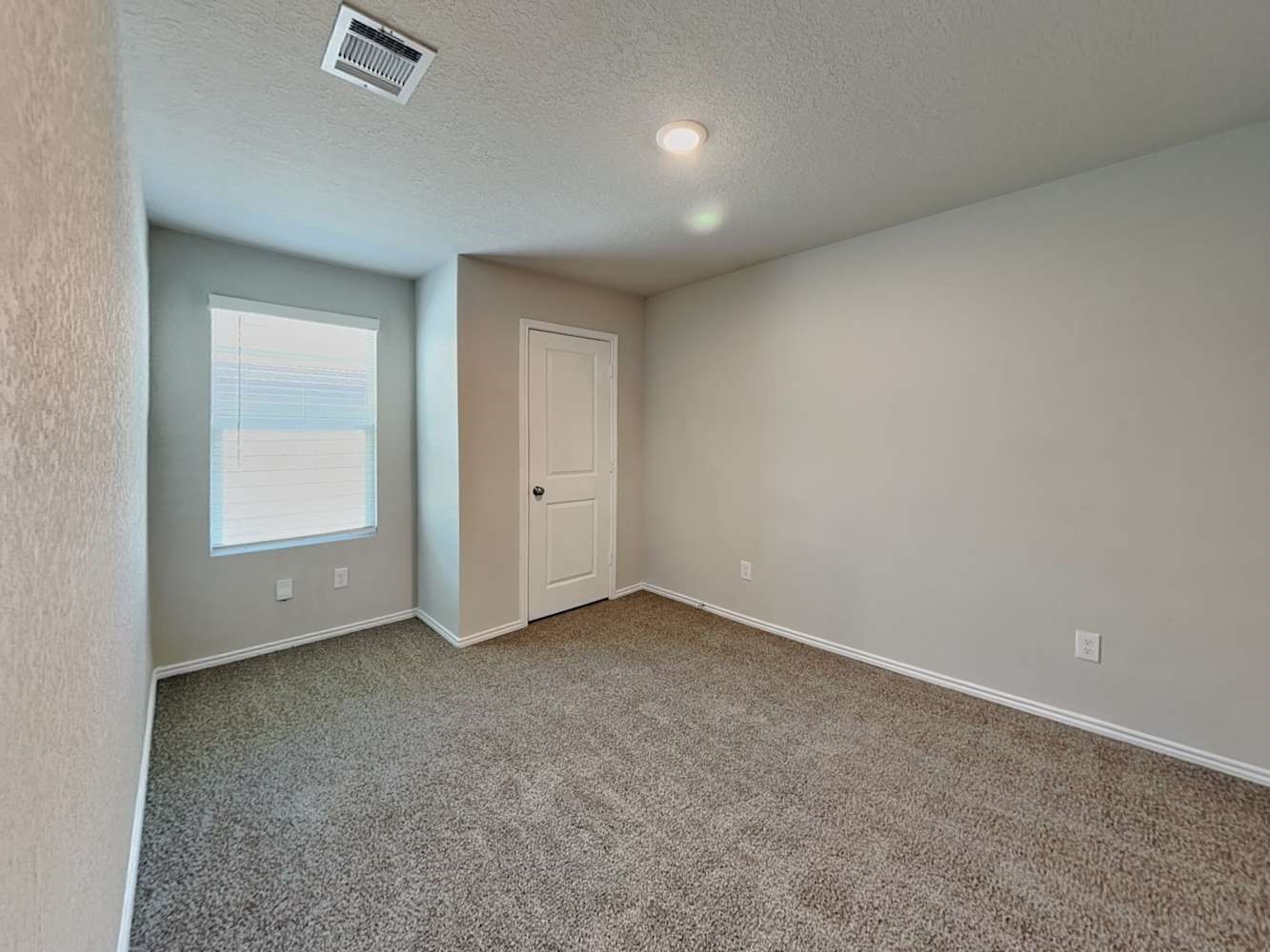 4322 Rapids Way San Antonio, TX 78223 - Photo 13 of 17 an empty room with windows