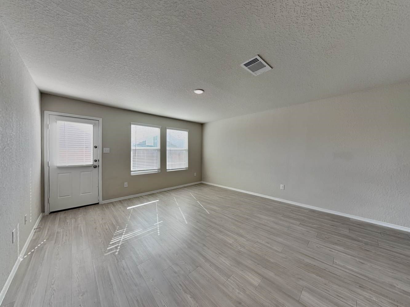 4322 Rapids Way San Antonio, TX 78223 - Photo 2 of 17 a view of an empty room with wooden floor and a window