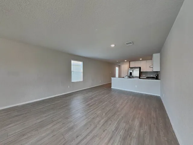 a view of kitchen and wooden floor