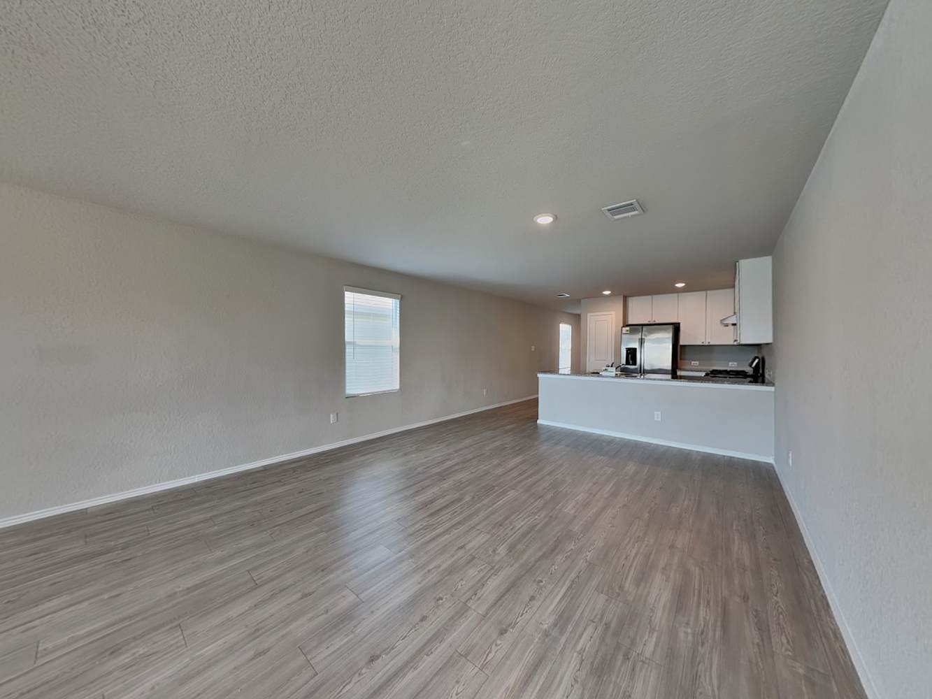 4322 Rapids Way San Antonio, TX 78223 - Photo 3 of 17 a view of kitchen and wooden floor