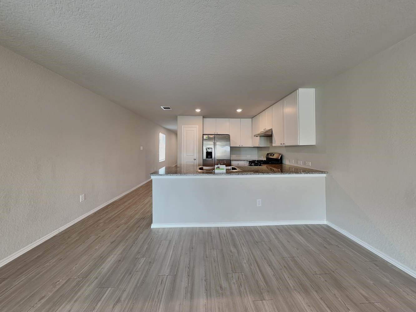 4322 Rapids Way San Antonio, TX 78223 - Photo 4 of 17 a view of kitchen living room with wooden floor and kitchen