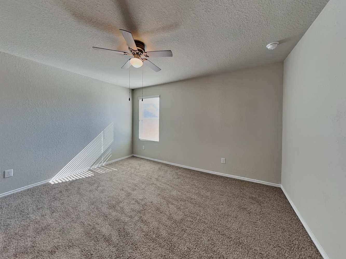 4322 Rapids Way San Antonio, TX 78223 - Photo 7 of 17 a view of an empty room with a window
