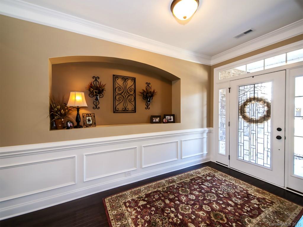 930 Solandra Way Tega Cay, SC 29708 - Photo 2 of 24 a bathroom with a sink a mirror and a window