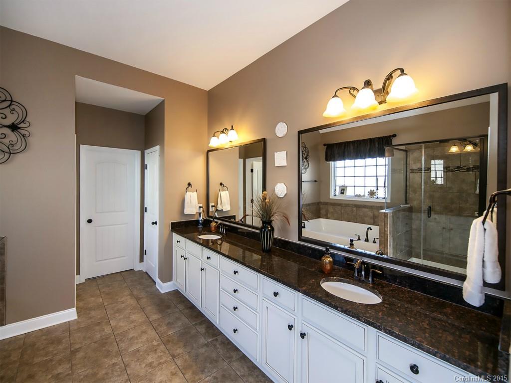 930 Solandra Way Tega Cay, SC 29708 - Photo 17 of 24 a bathroom with a sink and a mirror