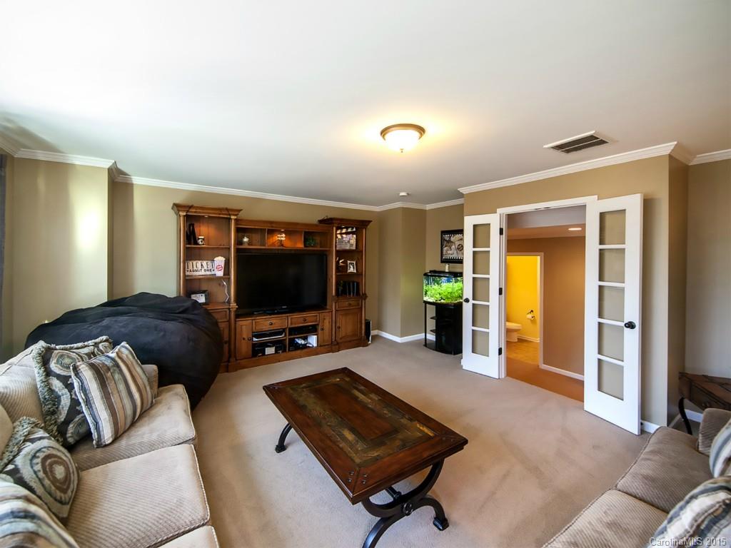 930 Solandra Way Tega Cay, SC 29708 - Photo 22 of 24 a living room with furniture and a flat screen tv