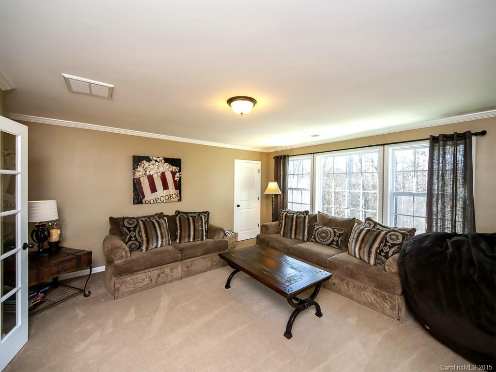 930 Solandra Way Tega Cay, SC 29708 - Photo 23 of 24 a living room with furniture and a large window