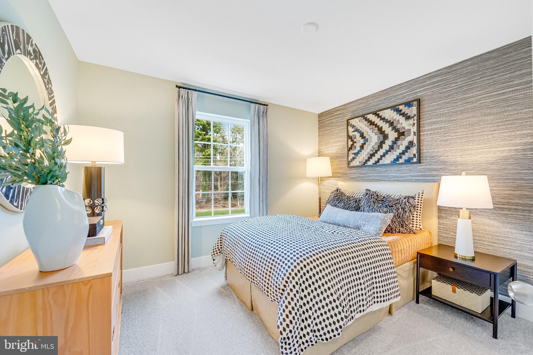 1723 Water Xing Road Baltimore, MD 21208 - Photo 16 of 21 a bedroom with a bed and a lamp