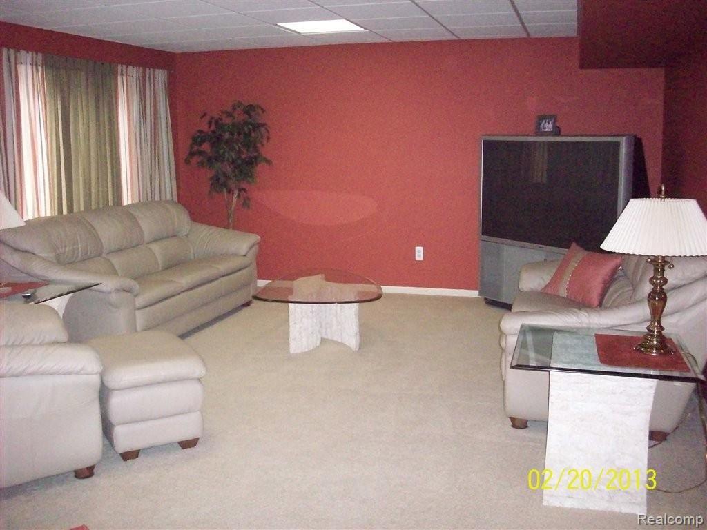 1044 Spirea, Unit 57 Howell, MI 48843 - Photo 22 of 23 Cozy Family Room in Basement