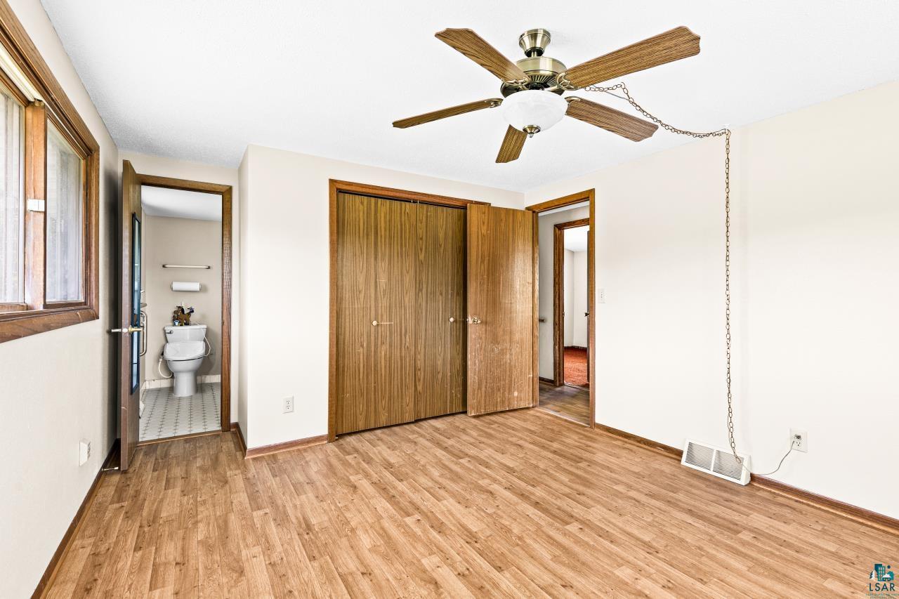 6606 Metso Road Kettle River, MN 55757 - Photo 4 of 84 Room with wood-finish flooring, featuring a ceiling fan with integrated lighting