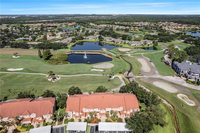 a view of a building with car parked