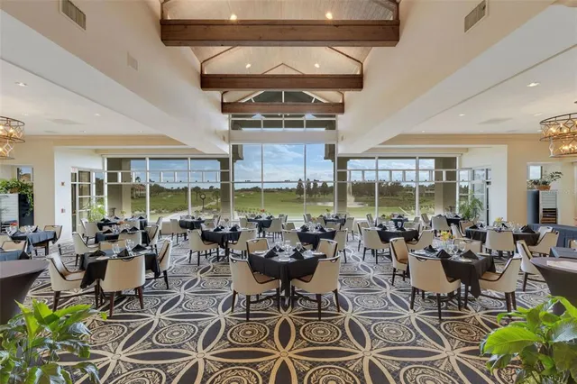a view of a patio with a table chairs and a table