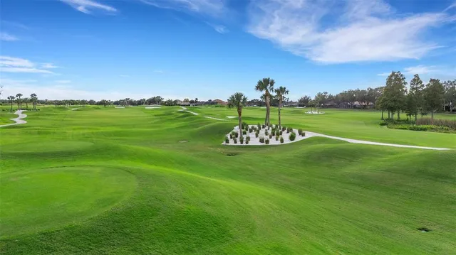 an aerial view of a house with a garden and swimming pool