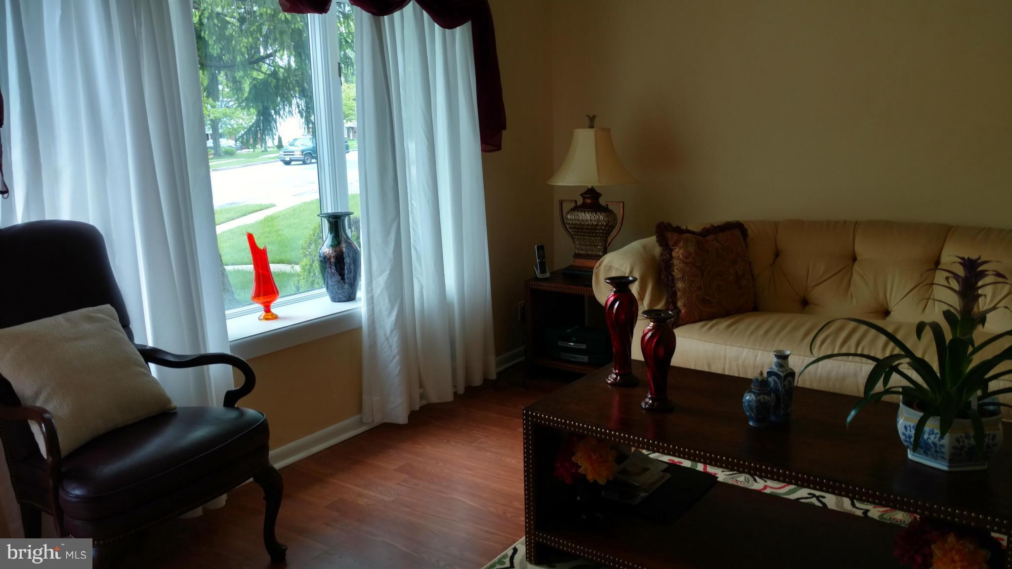 7136 Bexhill Road Baltimore, MD 21244 - Photo 2 of 27 a living room with furniture and a window